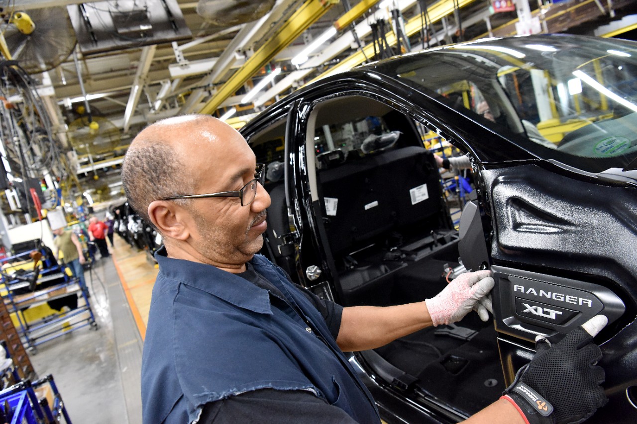 A Ford employee in Wayne, Michigan, builds a Ford Ranger truck